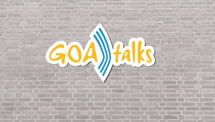 Das Logo von GOA talks auf einer Ziegelwand